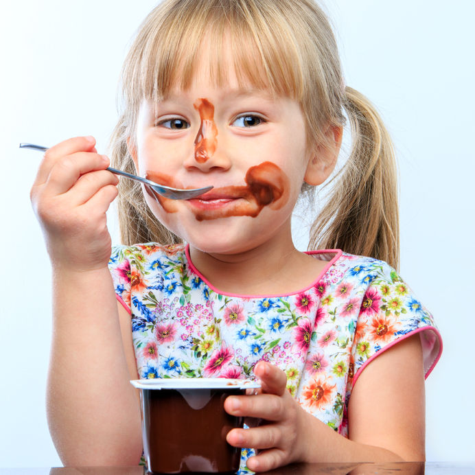 Girl eating chocolate mousse