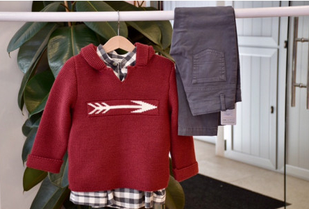 Boy's red jumper with arrow
