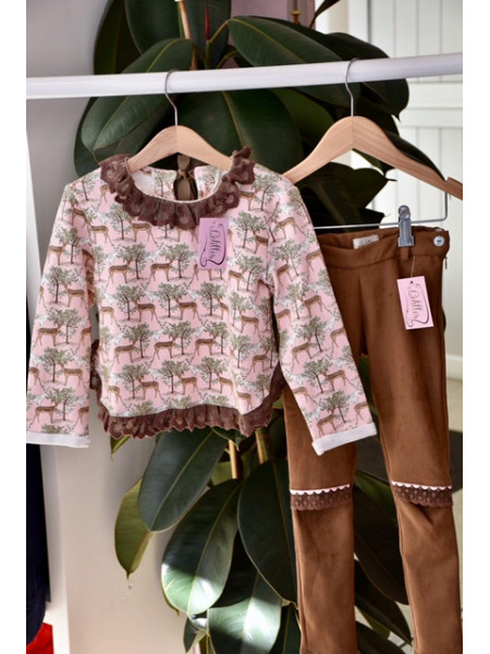 Girl's pink sweater and brown trousers