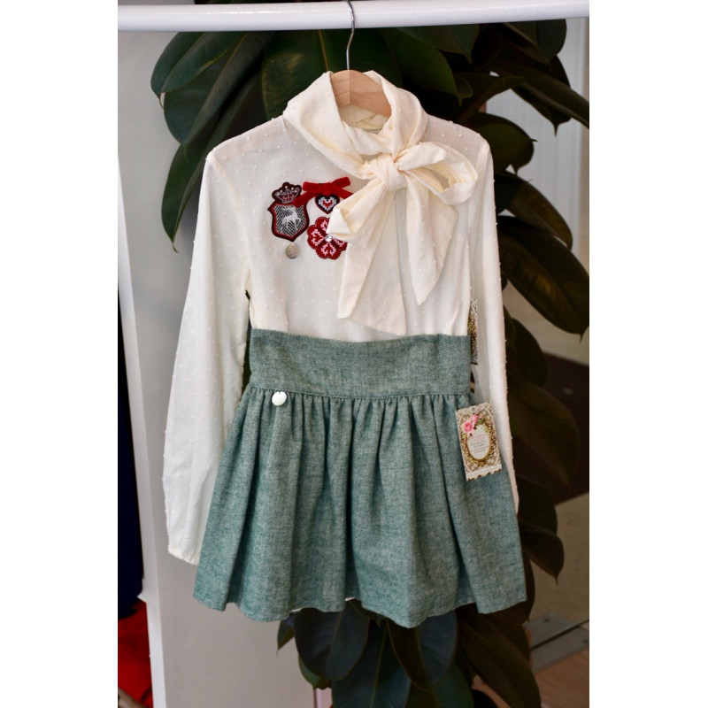 Girl's blouse and green skirt